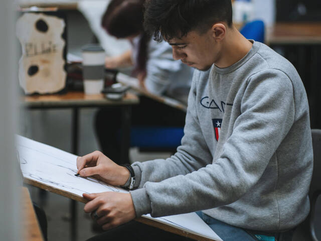 A student doing a drawing