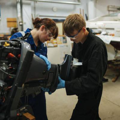 Learners fixing a speed boat