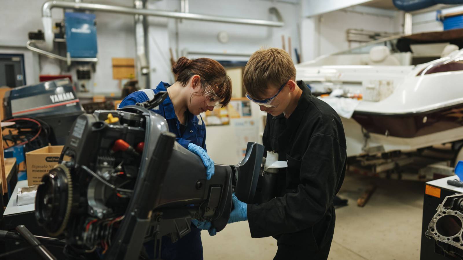 Learners fixing a speed boat