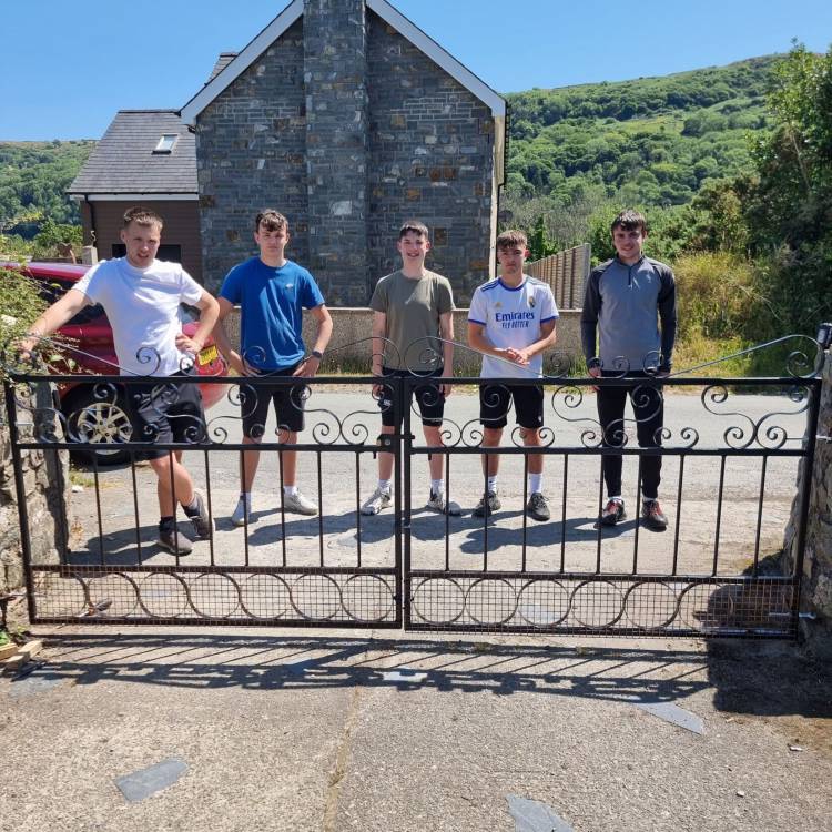 Students Huw Jones, Caio Morgan, Cian Jones, Cian Pritchard and Kevin Evans with the gate after installing it