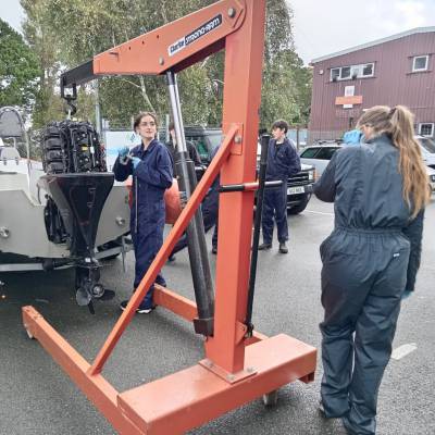 Heather Griffiths and Morgandie Harrold working on a boat at Coleg Meirion-Dwyfor’s Hafan campus in Pwllheli