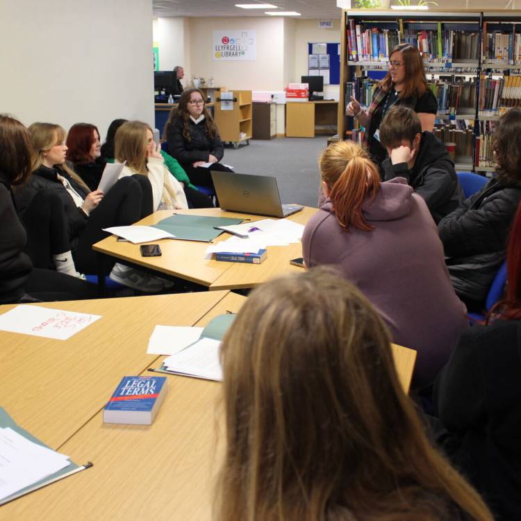 Students taking part in a debate in the library at Coleg Llandrillo’s Rhos-on-Sea campus