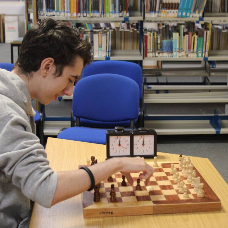 Students taking part in a chess tournament at Coleg Llandrillo’s Rhos-on-Sea library