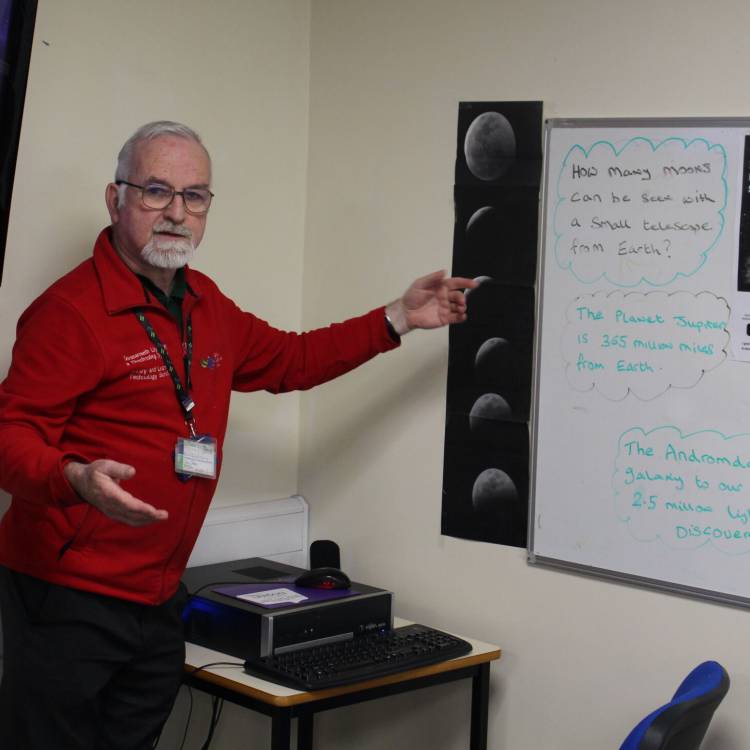 Library print shop assistant Brian Woosnam giving a lecture on astronomy