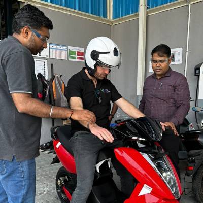 Coleg Llandrillo lecturer Paul Griffith trying an electric bike in India