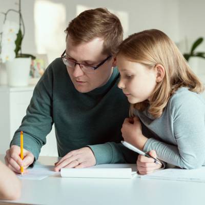 Parent helping child with homework