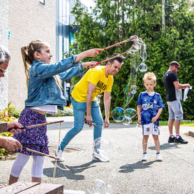 A girl playing with bubbles at the Llangefni Community Fun Day in 2023