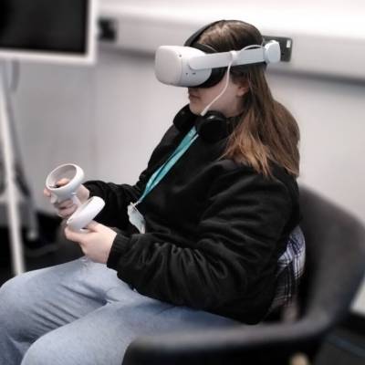 A Coleg Meirion-Dwyfor learner using a virtual reality headset at M-SParc in Gaerwen