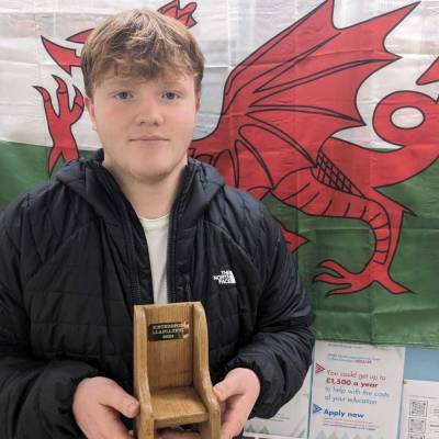 Huwcyn Griffith Jones with the Young People Trophy at Eisteddfod Llanllyfni