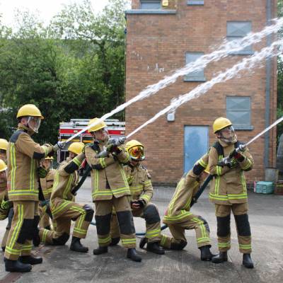 Coleg Llandrillo students using fire hoses as part of their Phoenix Project course