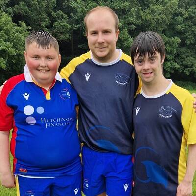 Grŵp Llandrillo Menai and Welsh Rugby Union Rugby Engagement Officer Ollie Coles with Aaron and Asa