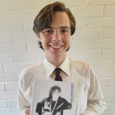 Oskar Jones with his photo book ‘College Days’