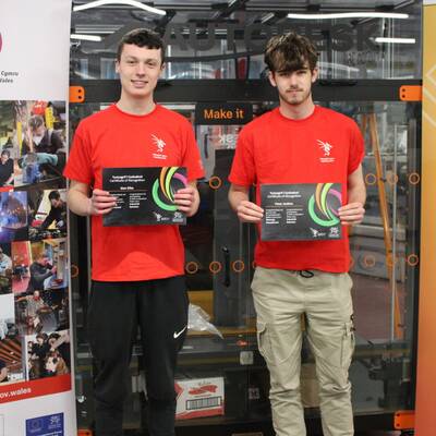 Coleg Menai students Sion Elias and Peter Jenkins with their certificates after competing in Skills Competition Wales 2024