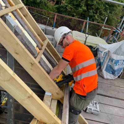 Carpentry and joinery apprentice Cain Jones working on a house