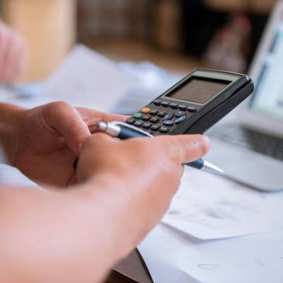 A man using a calculator