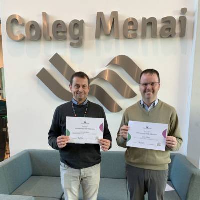 Coleg Menai lecturers Carwyn Jones and Guto Jones holding their Accounting Club Educator certificates