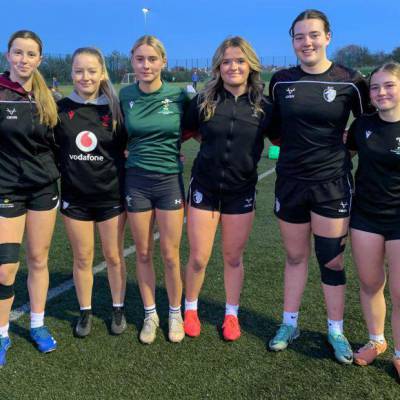 Six students from Grŵp Llandrillo Menai's girls' rugby who have been selected for a Wales under-18s training camp