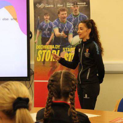 Dr Seren Evans talking to school students at a WRU Leadership day at Coleg Llandrillo in Rhos-on-Sea