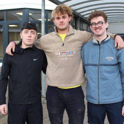 Former Coleg Llandrillo students Lewis Bartlett, Henry Wilyman and Dylan Michaelson outside the sports lounge at the Rhos-on-Sea campus