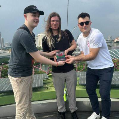 Jack Williams with James Borley and Alex Dunham holding their trophy for third place in YYY2024 in Singapore