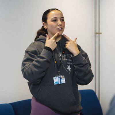 Coleg Menai dance lecturer Lucy Hawken talking to students at the new Bangor campus