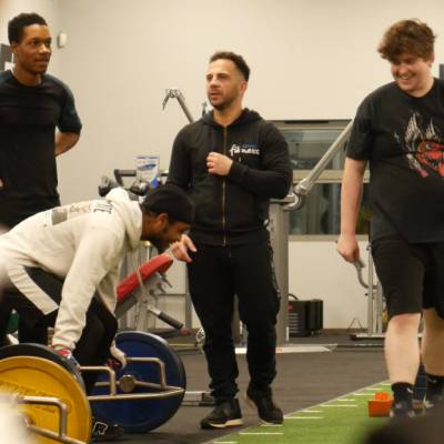 Multiply learners with personal trainer Costa Yianni during a weightlifting class in The Barn, Parc Eirias