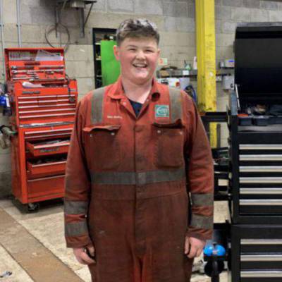 Former Coleg Meirion-Dwyfor student Ned Pugh next to a tool cabinet in Cyngor Gwynedd’s Dolgellau depot