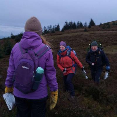 Multiply learners hiking in the Clwydian Range during a navigation course