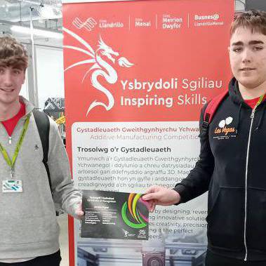 Coleg Meirion-Dwyfor students Keegen and Jordan with their certificate after competing in Skills Competition Wales