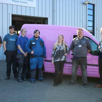 Coleg Llandrillo staff and students with Prom Ally founder Ally Elouise and her newly painted van