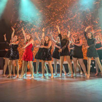Coleg Menai Performing Arts students on stage at Pontio theatre in Bangor during their 2025 end-of-year show, Sweet Charity