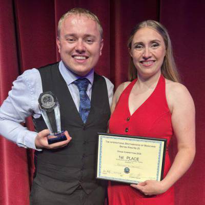 Dean Raymond and Kazia Cannon with their award and certificate after being named ‘Stage Magicians of the Year’