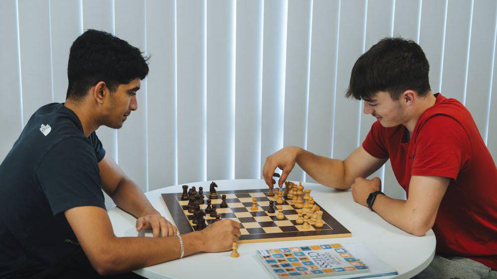 Students playing chess