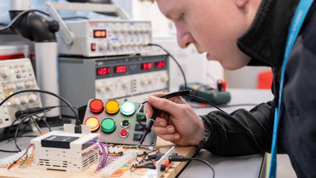 Student working on an electrical board