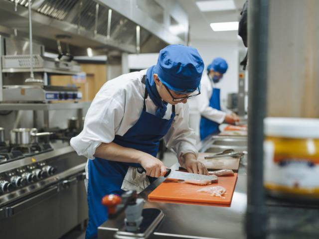 Student working in a kitchen