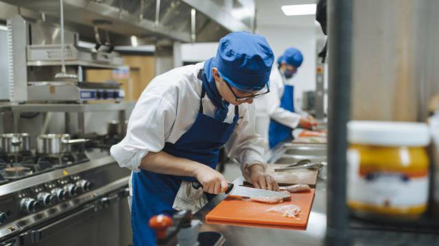 Student working in a kitchen