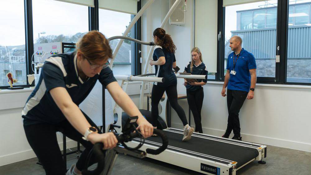 Students using sports equipment