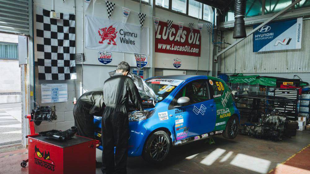 Students working on a car